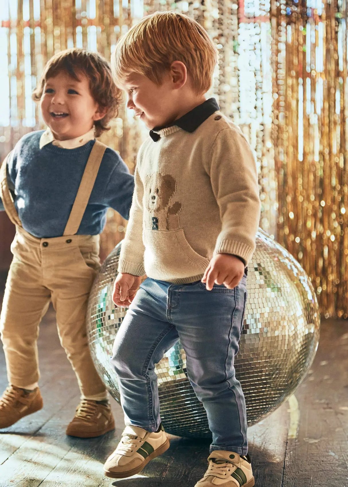 Toddler boy wearing Mayoral baby jeans in light-wash blue with adjustable waist; comfy fit for school, photos, and play.