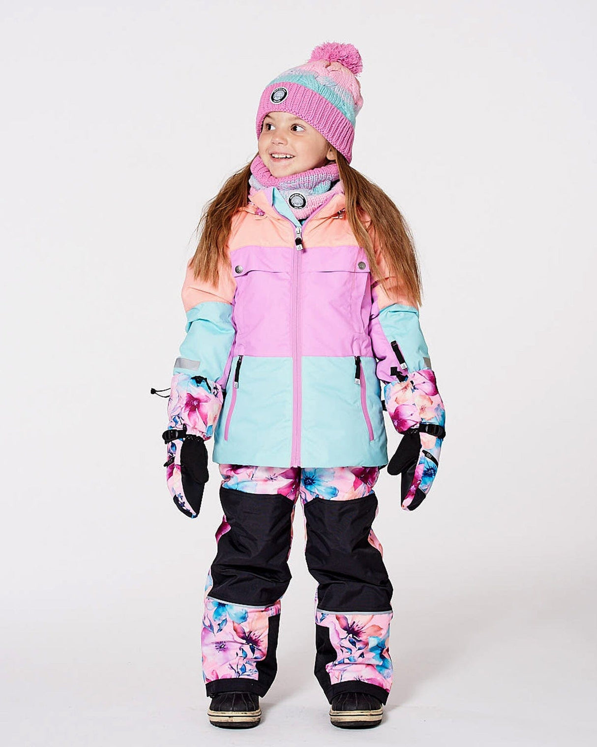 Front flat lay of colorblocked jacket with pink watercolor flower bib pants — Deux par Deux two-piece snowsuit
