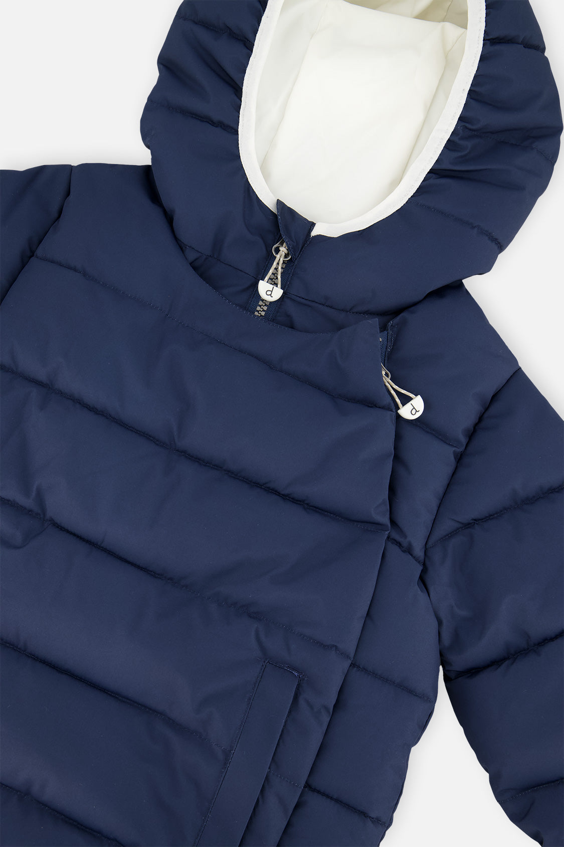 Close-up of the dark blue jacket hood lining and snap front panel