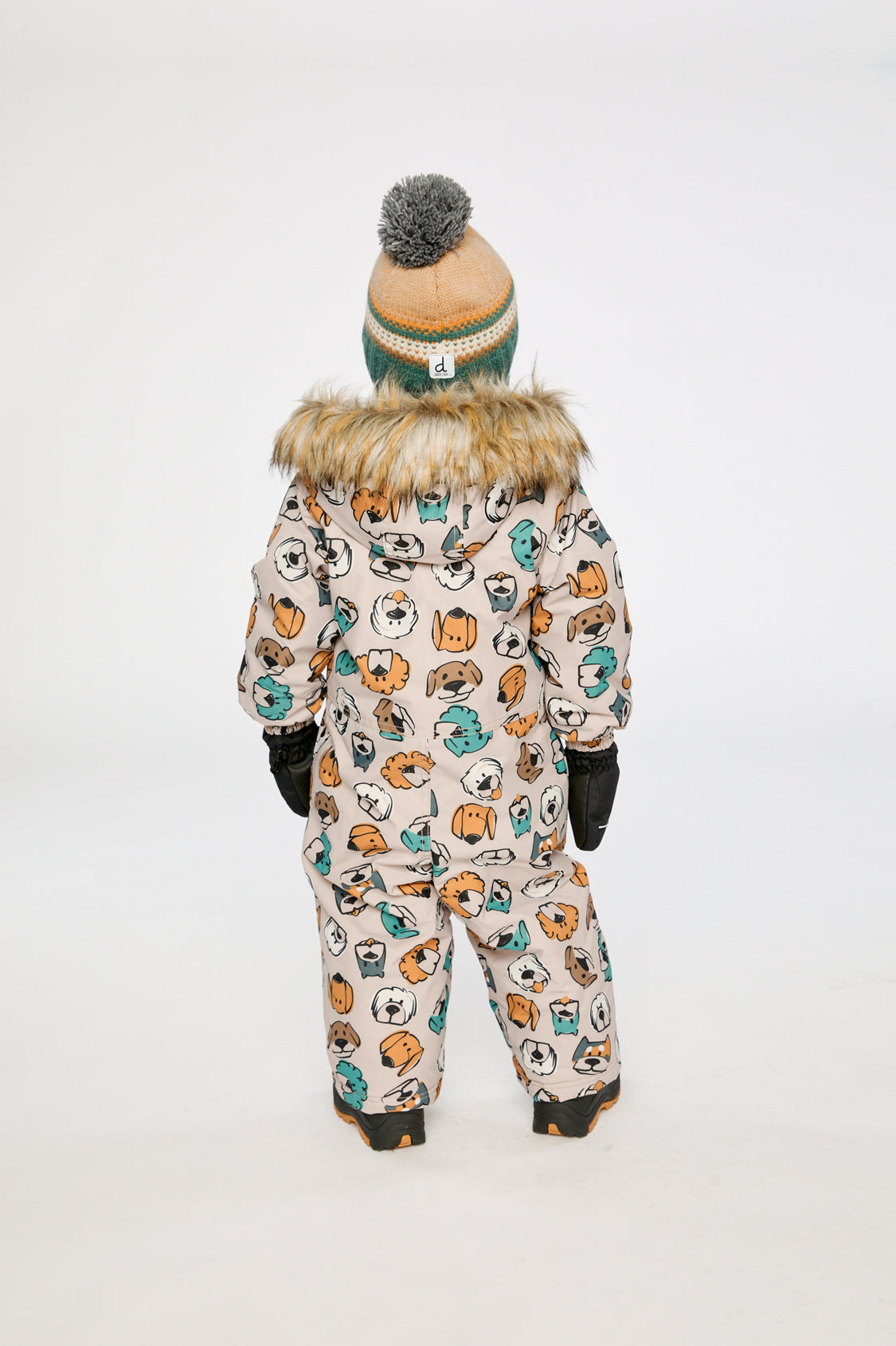 Baby wearing the beige snowsuit with dog print, lookbook image