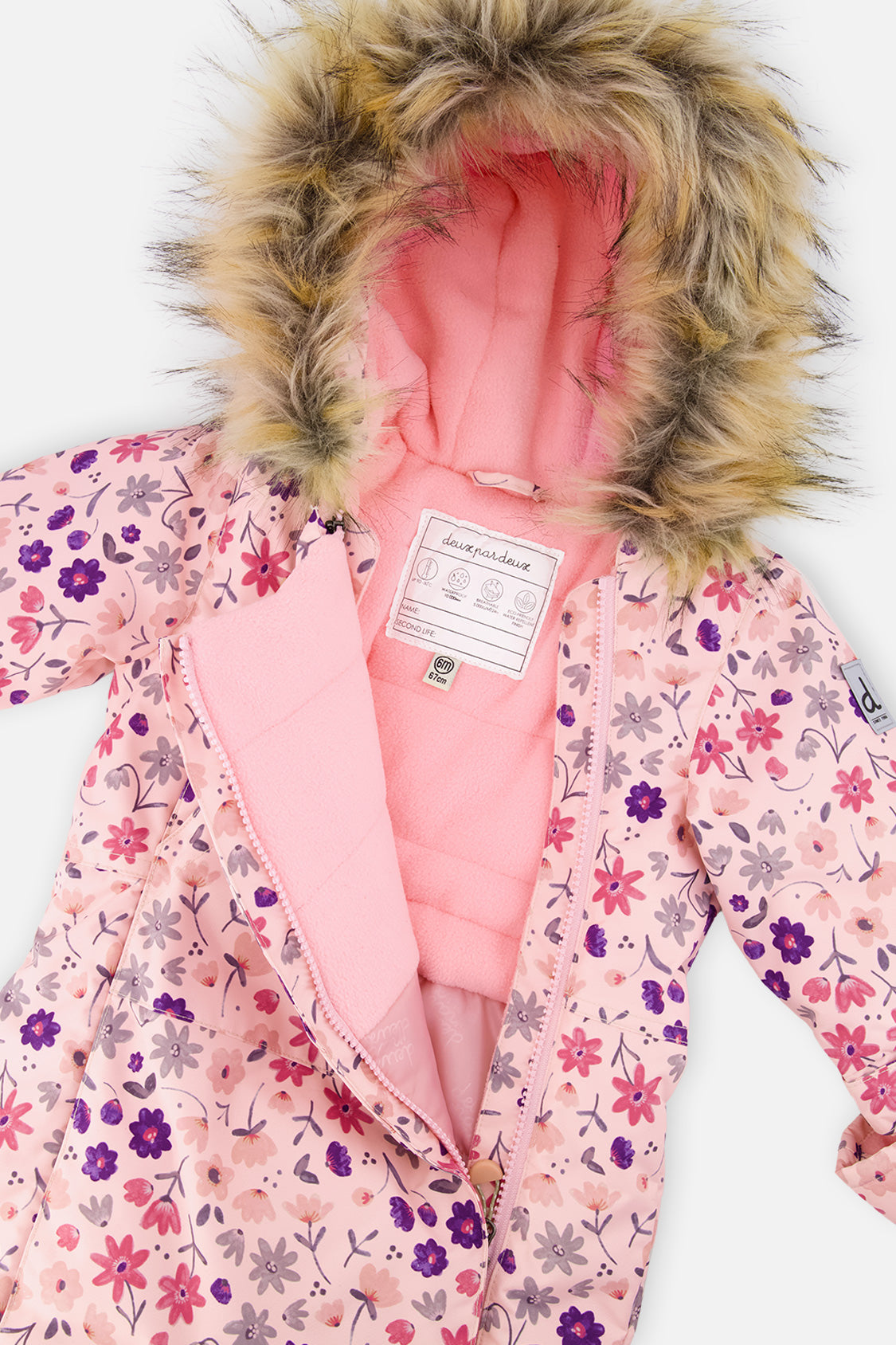 Close-up of the faux-fur trimmed hood and fleece-lined chest of the pink mini flower print snowsuit