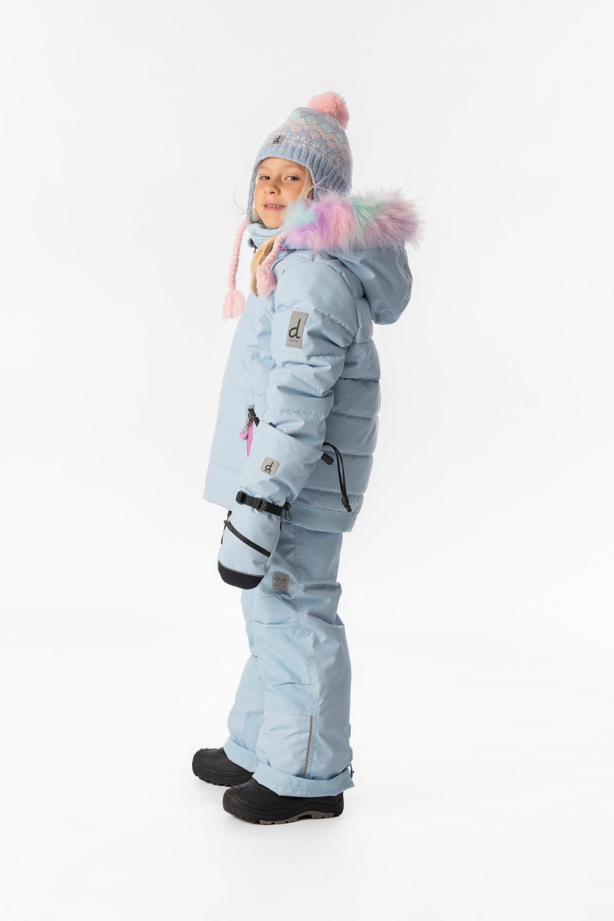 Girl in the light blue Deux par Deux PLAY snowsuit, side view