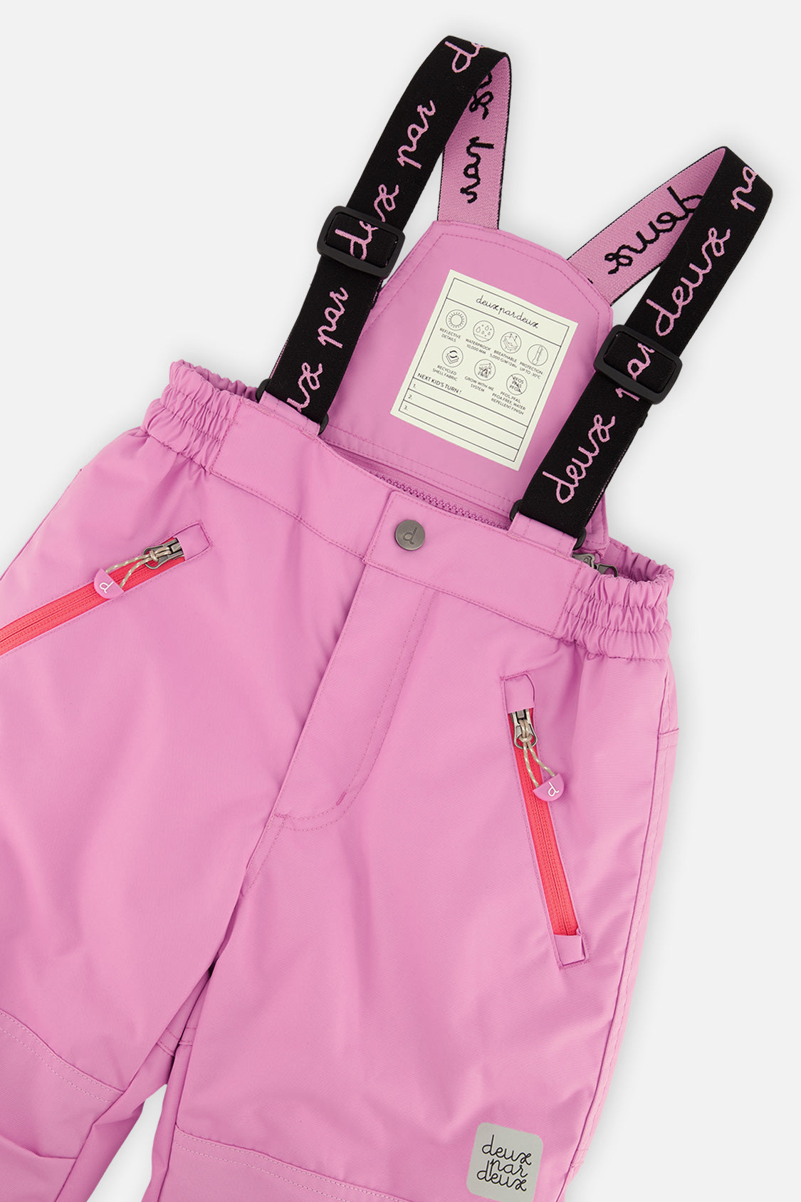 Deux par Deux girls PLAY snowsuit, pinkish violet and pink – close-up of the suspenders and zippered pant pockets