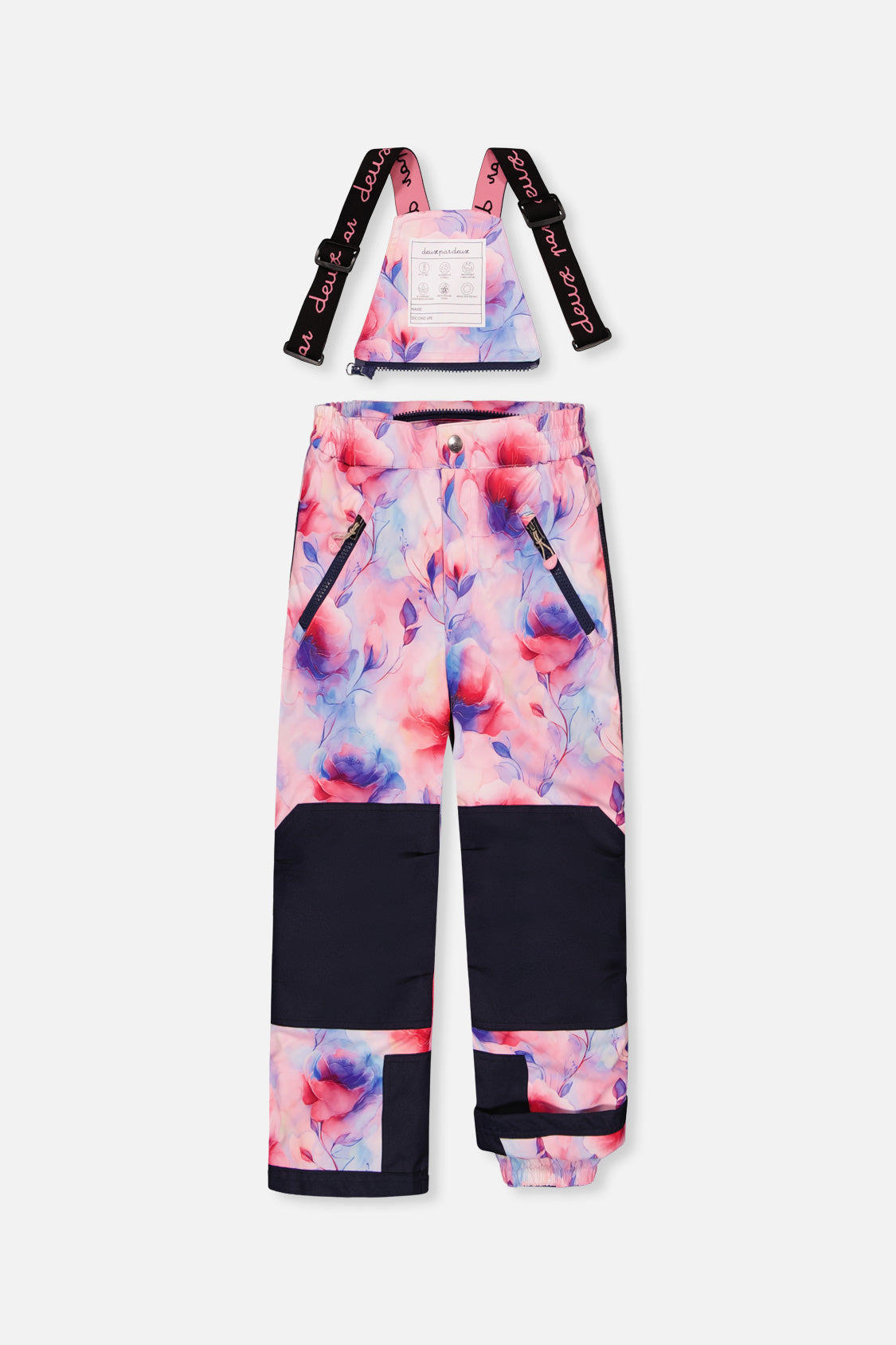 Watercolor floral PLAY snow pants with navy knee panels and suspenders, front view