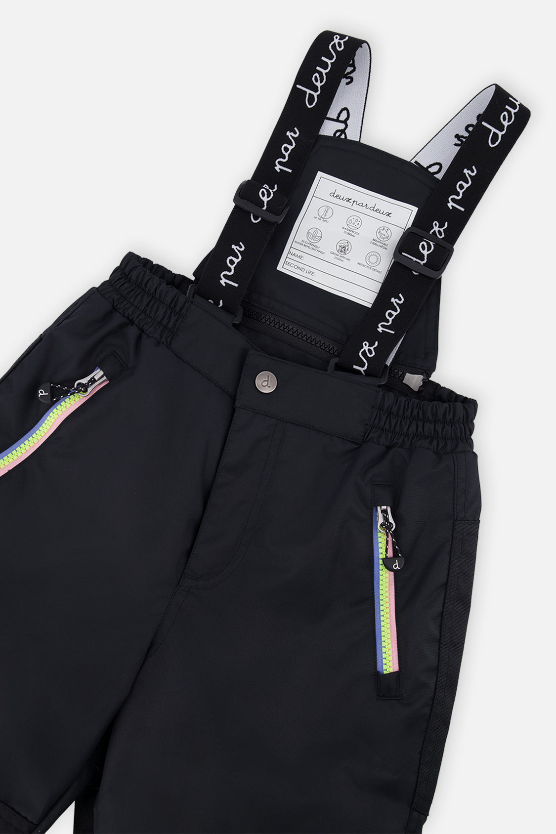 Close-up of the black snow pants suspenders and zippered pocket