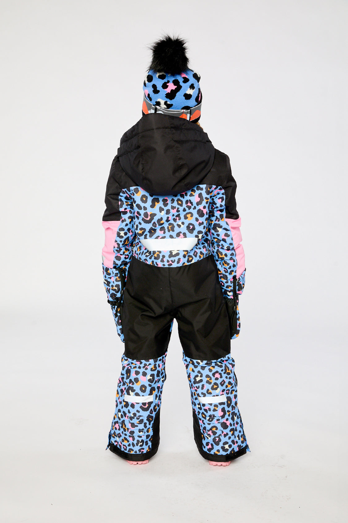 Deux par Deux girls' TEKNIK one-piece snowsuit in blue leopard print – worn by a model, view 4