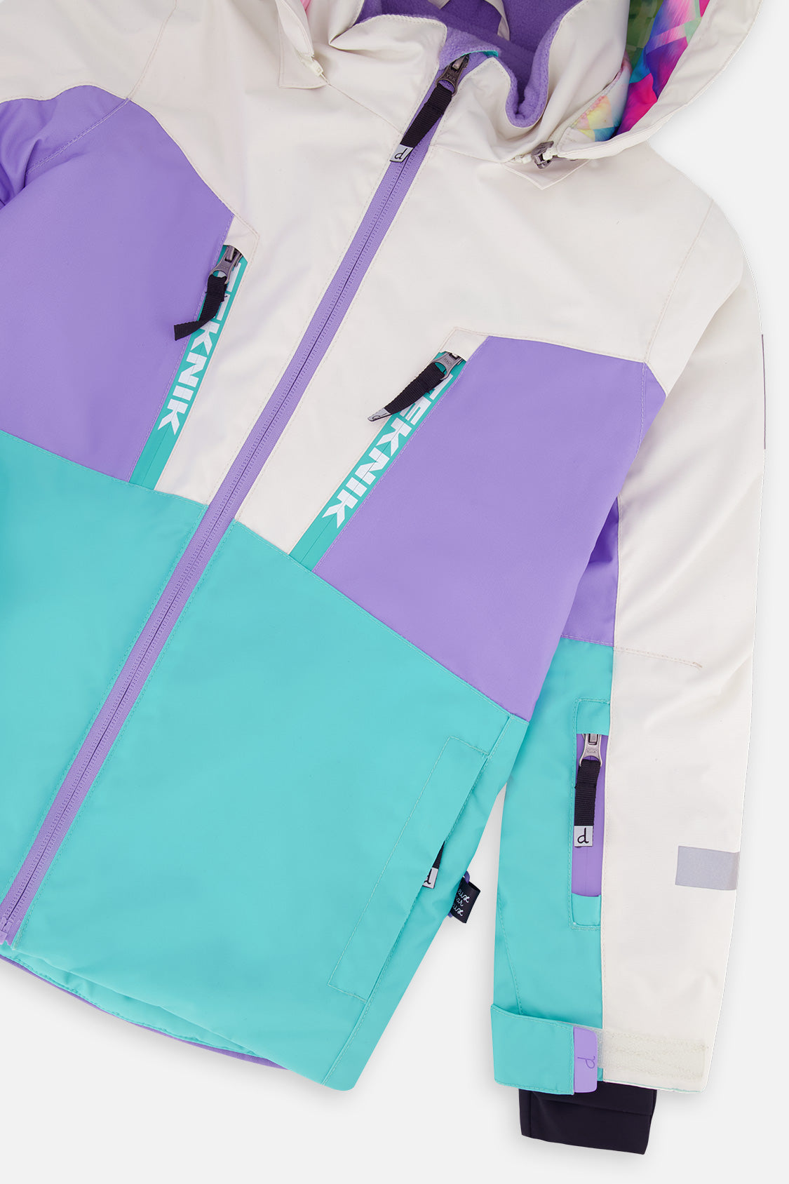 Deux par Deux girls' TEKNIK two-piece snowsuit in a multicolored diamond pattern, additional studio angle