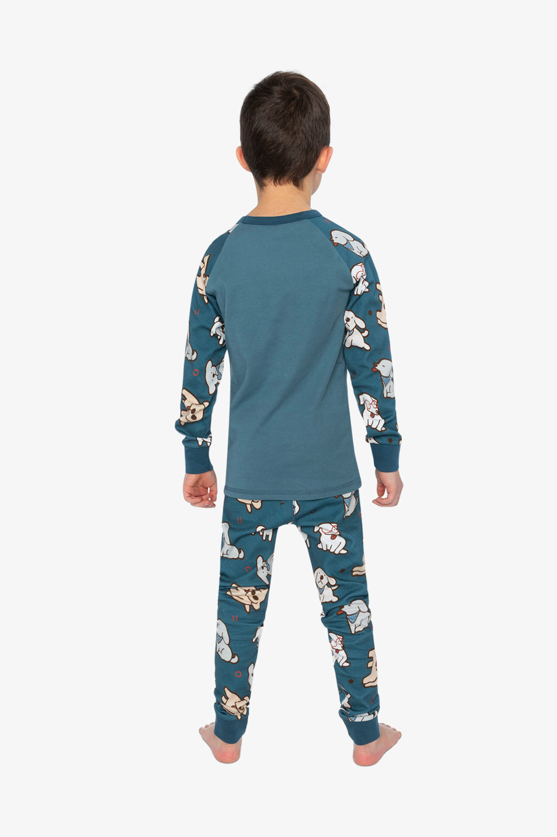 Child wearing the Deux par Deux turquoise dog print organic cotton pajama set, lookbook photo 3