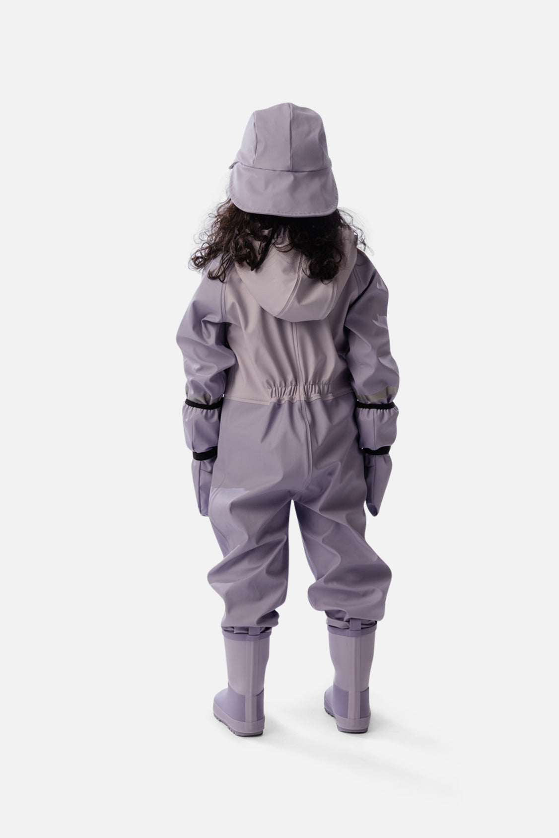 Child wearing the Deux par Deux mauve rain one-piece, second lookbook shot
