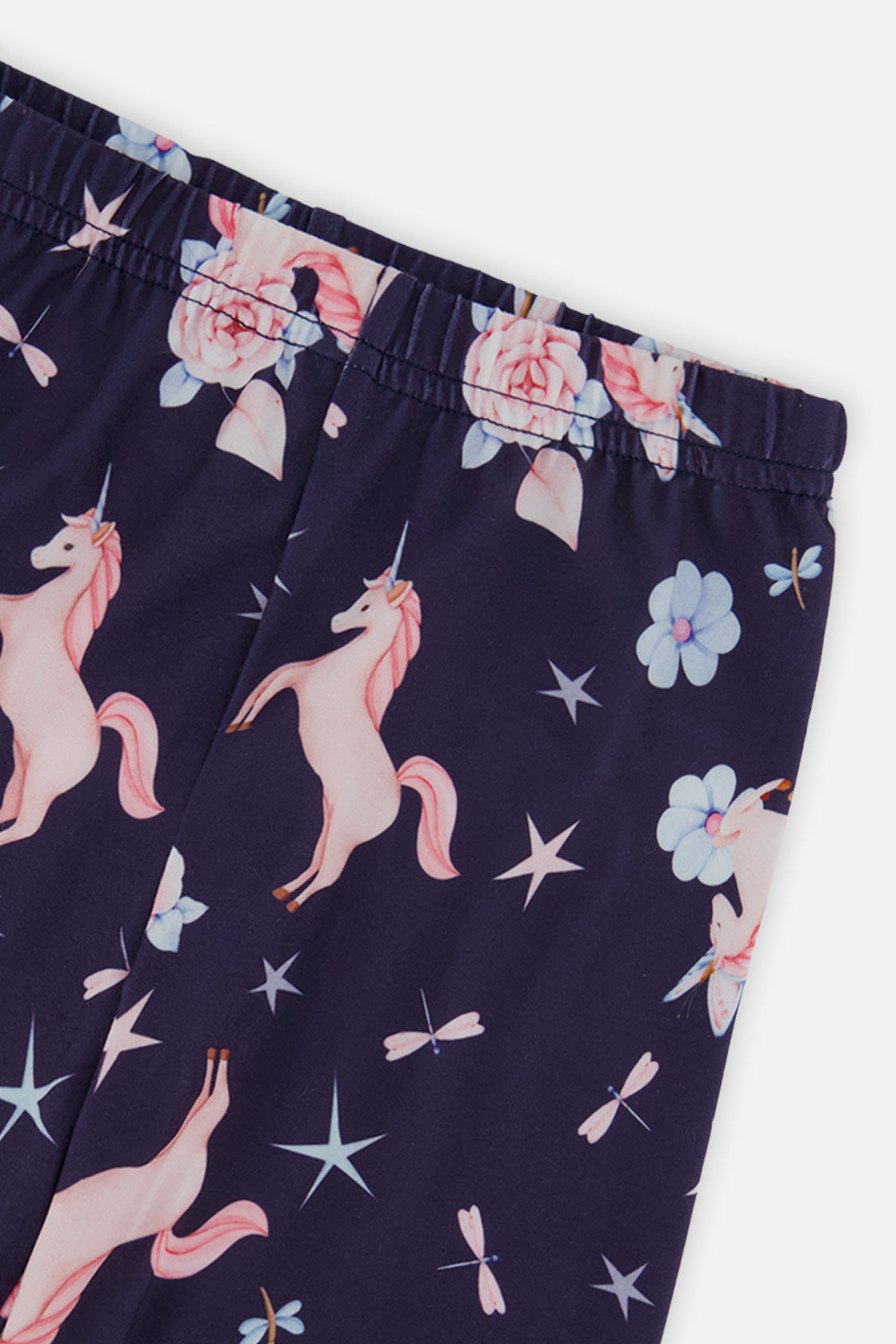 Close-up of the elastic waistband and pink unicorn print