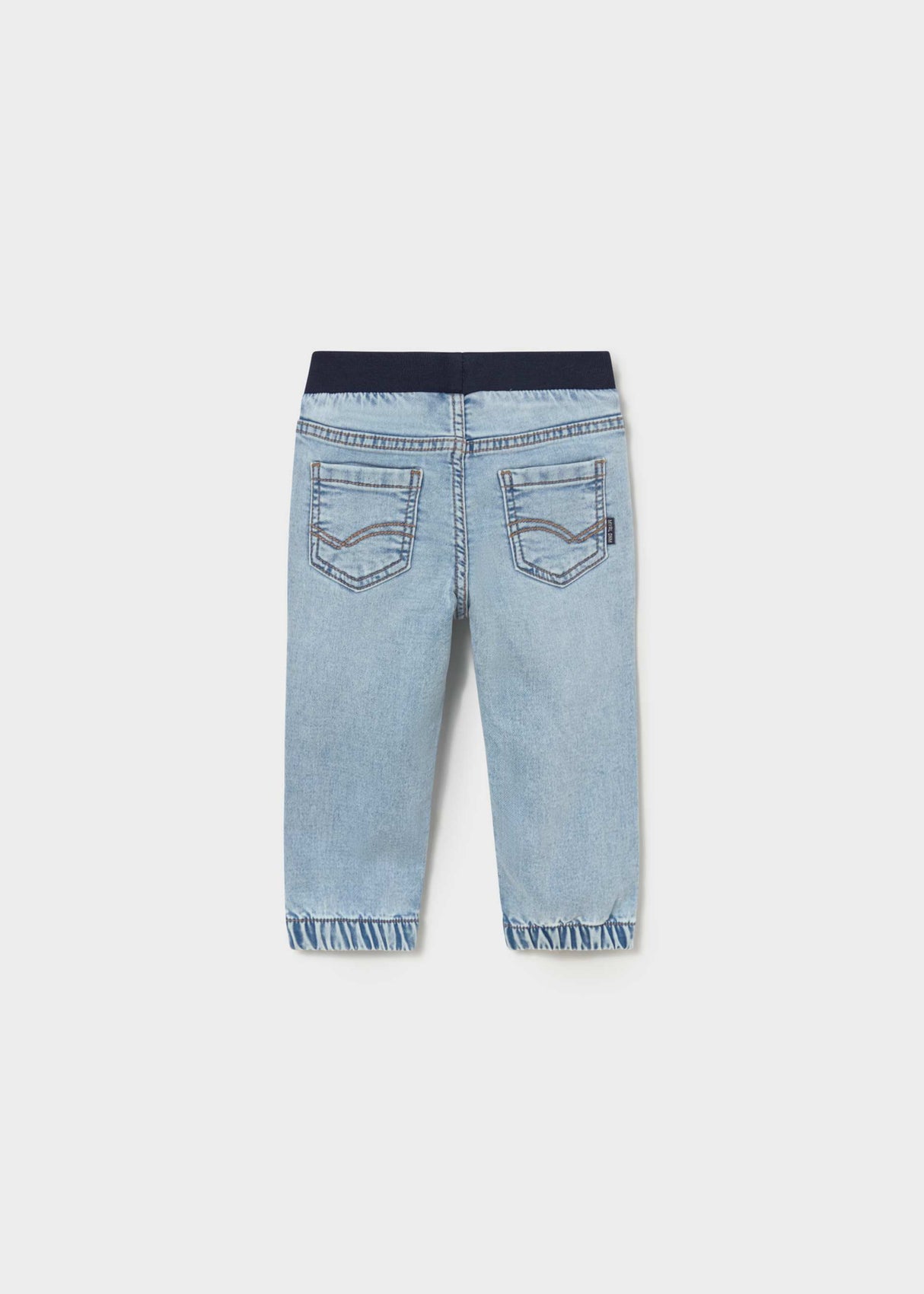 Back view of Mayoral baby boy jogger jeans showing Light Blue denim wash and cuffed leg openings.