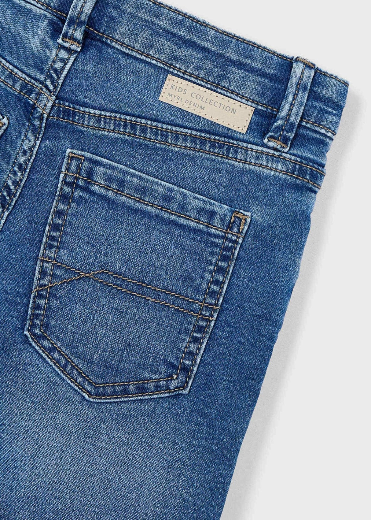 Closeup of Mayoral denim shorts showing pocket stitching, waistband detail, and stretch denim texture.