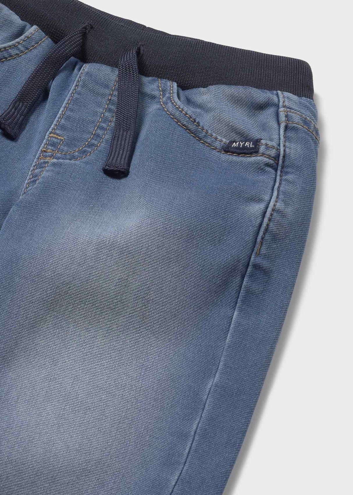 Close-up waistband on Mayoral denim joggers—soft stretch denim with secure drawstring