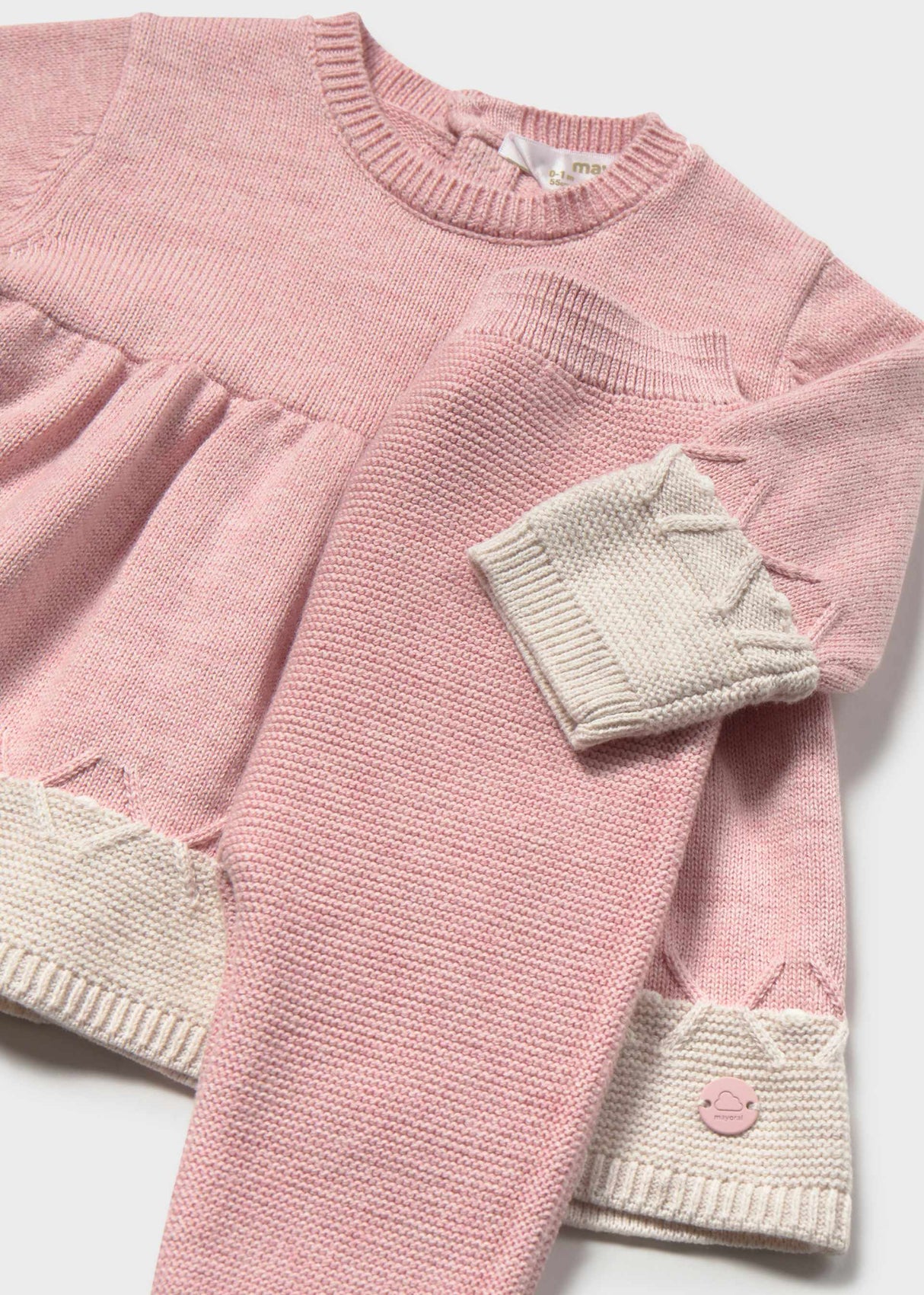 Close-up of Mayoral newborn girl outfit set showing Pink cotton dress, matching leggings, and Cream cuffs.