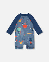 Back view of blue marine animals print long sleeve one-piece for baby and toddler boys
