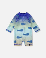 Front flat lay of Deux par Deux baby boy long sleeve one-piece swimsuit in blue whale print