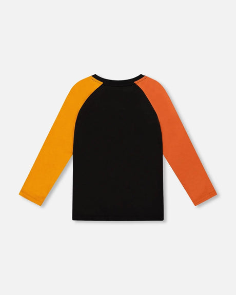 Black Long Sleeve Raglan T-Shirt With Glow-In-The-Dark Dinosaur Print | Deux par Deux | Jenni Kidz