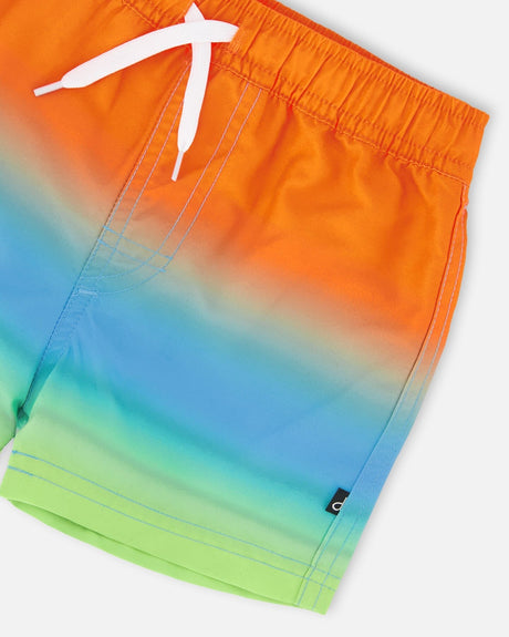 Close-up of waistband, drawstring, and ombré fabric on gradient swim shorts