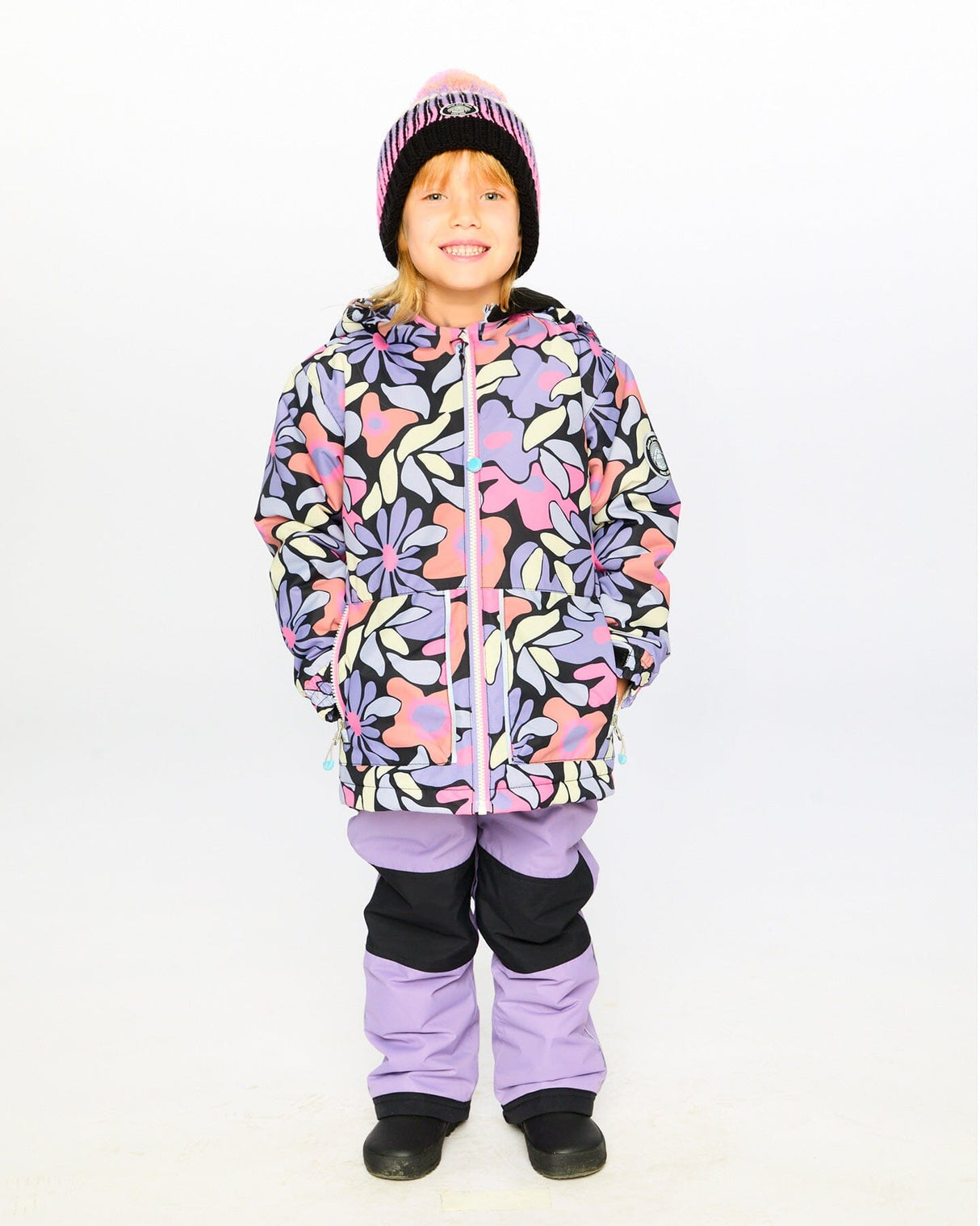 Child wearing Deux par Deux purple gray chill snowsuit outdoors – order now