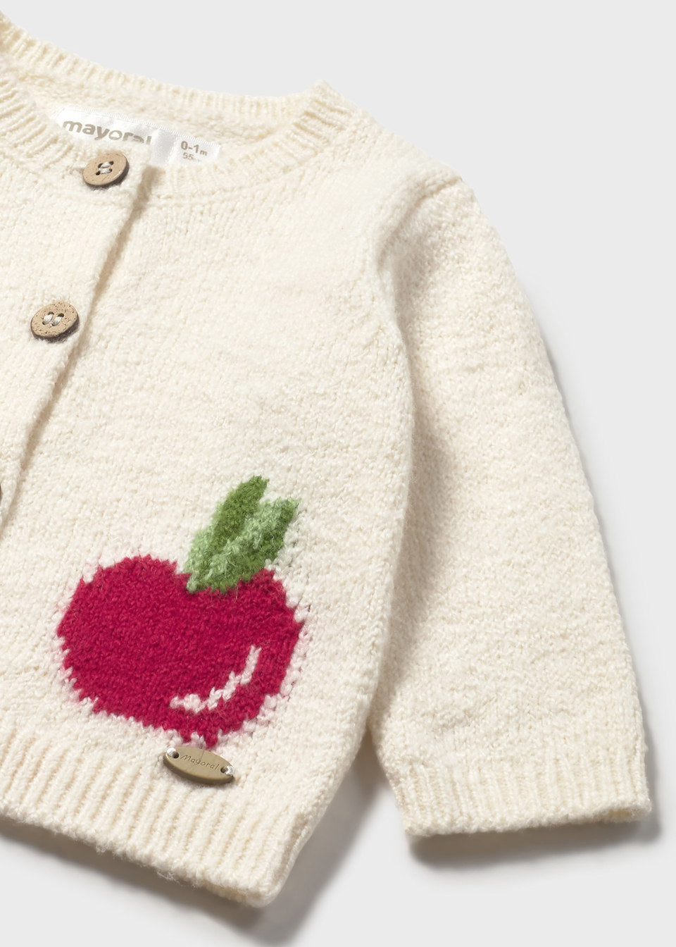 Close-up detail of embroidered apple design on Mayoral baby knit cardigan