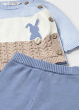 Close-up of jacquard design with pompom detail on Mayoral baby sweater