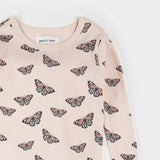 Close-up of monarch butterfly print on organic cotton rib kids pajama set