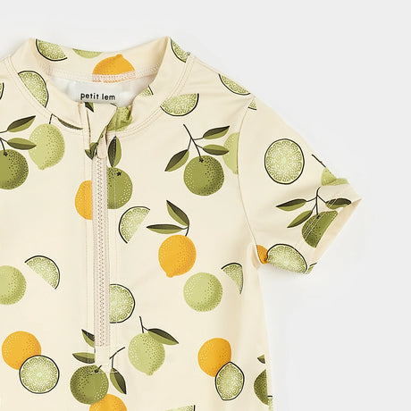 Close-up of recycled nylon fabric with citrus print on baby swim romper