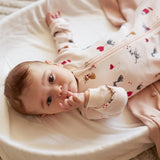 Infant wearing silver peony cat print footed sleeper with two-way zipper Petit Lem