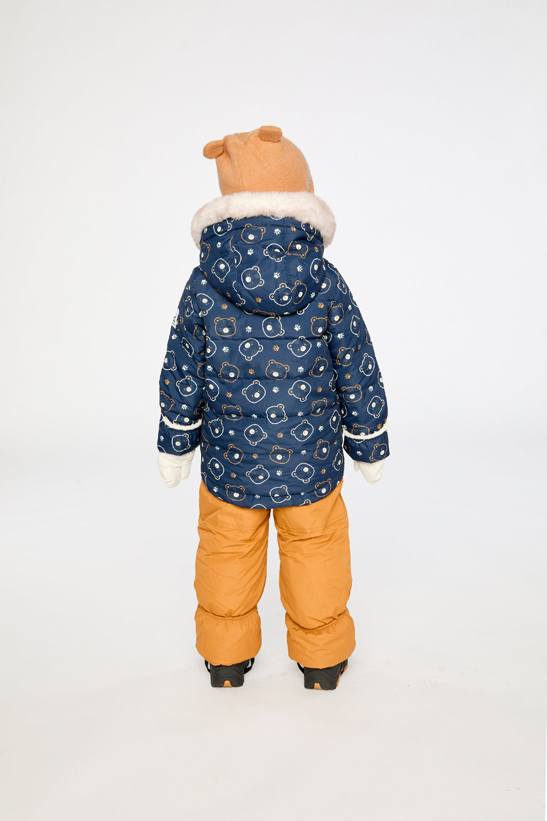 Child wearing the Deux par Deux teddy bear print snowsuit, third lookbook photo
