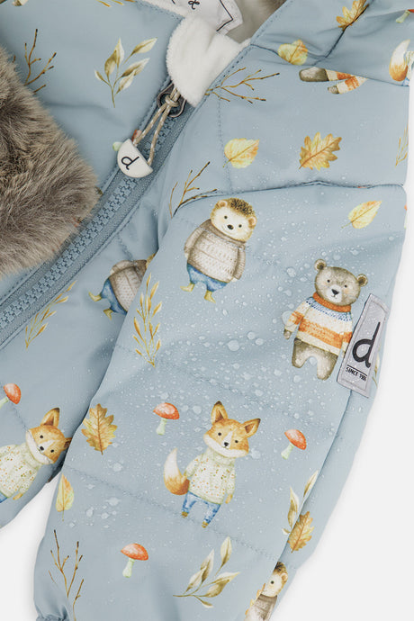 Close-up of the fox, owl and bear print on the pale blue snowsuit