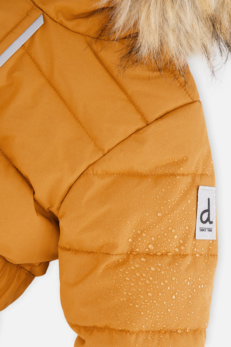Close-up of the Brown Sugar quilted shoulder with reflective details and logo tab