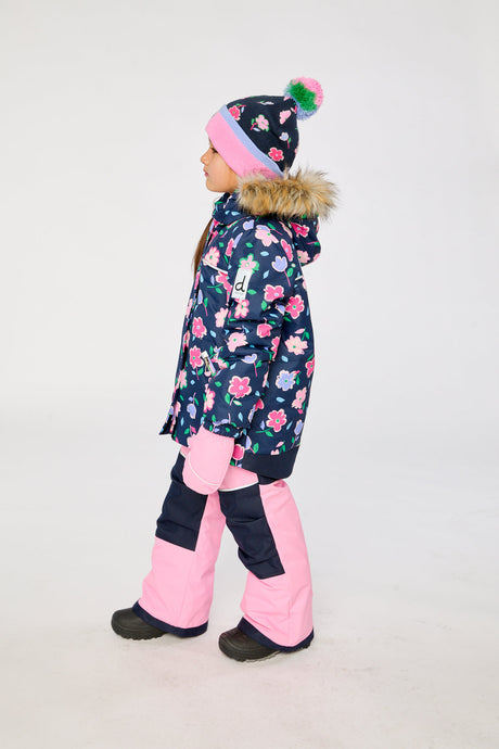 Child wearing the blue floral DISCOVER two-piece snowsuit by Deux par Deux, third lookbook photo