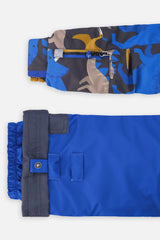 Close-up of the dinosaur PLAY jacket sleeve ski-pass pocket and the adjustable blue pant hem