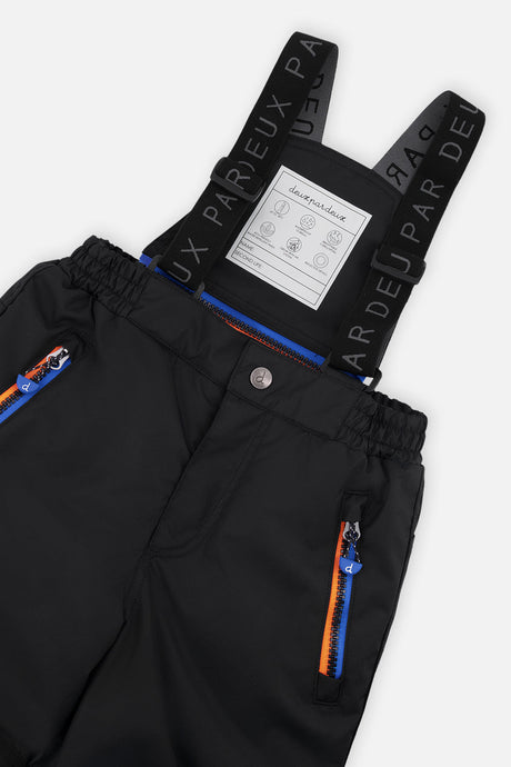 Deux par Deux boys' PLAY snowsuit, blue and orange gradient jacket with black pants, further studio view