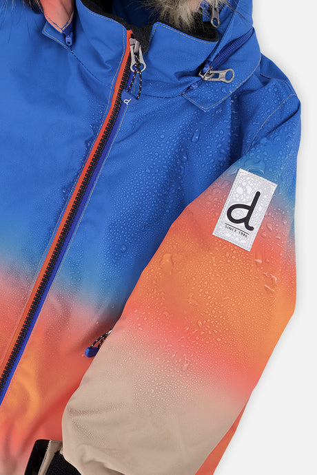 Deux par Deux boys' PLAY snowsuit, blue and orange gradient jacket with black pants, additional studio angle