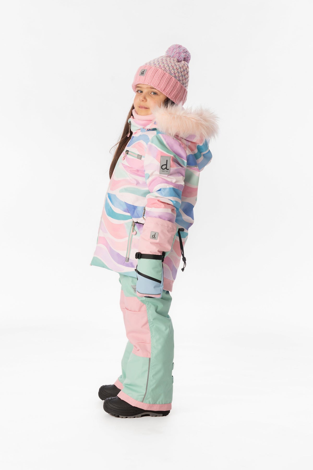 Girl in the multicolor line print Deux par Deux PLAY snowsuit, side view