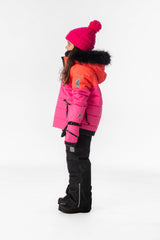 Girl in the coral, bright pink and black Deux par Deux PLAY snowsuit, side view