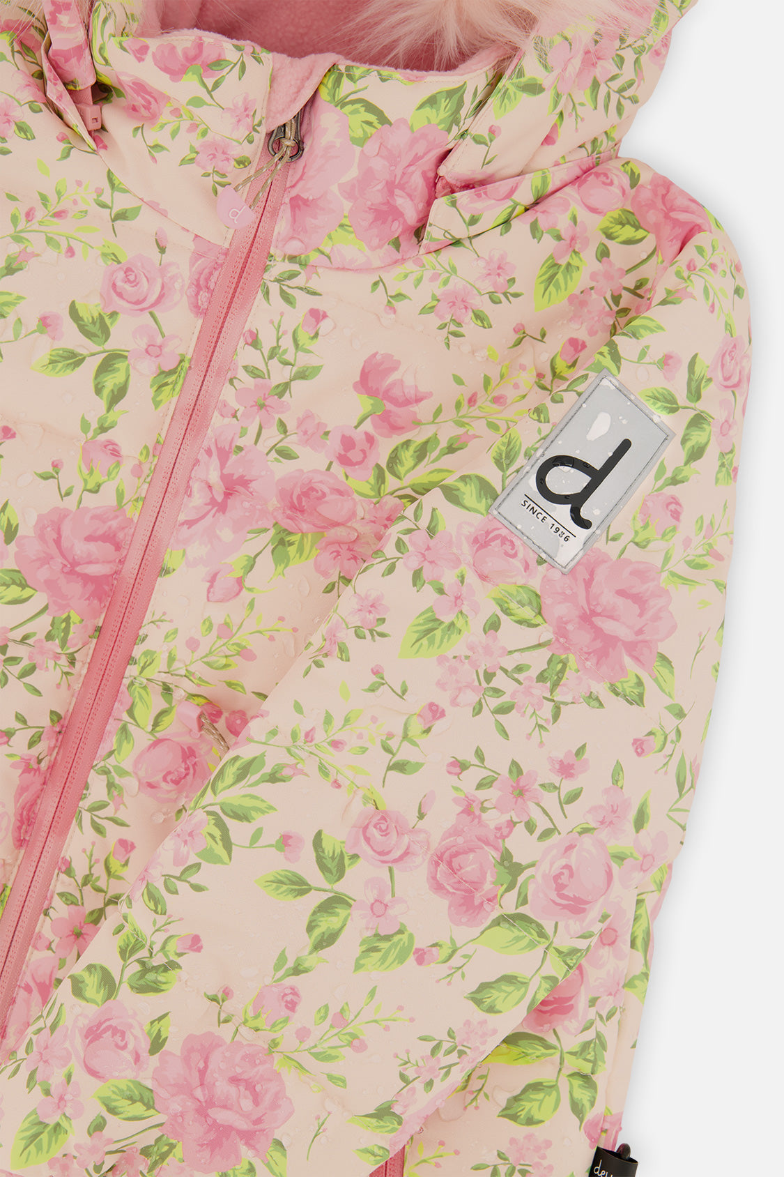Close-up of the pink mini flower print with front zipper and Deux par Deux logo patch