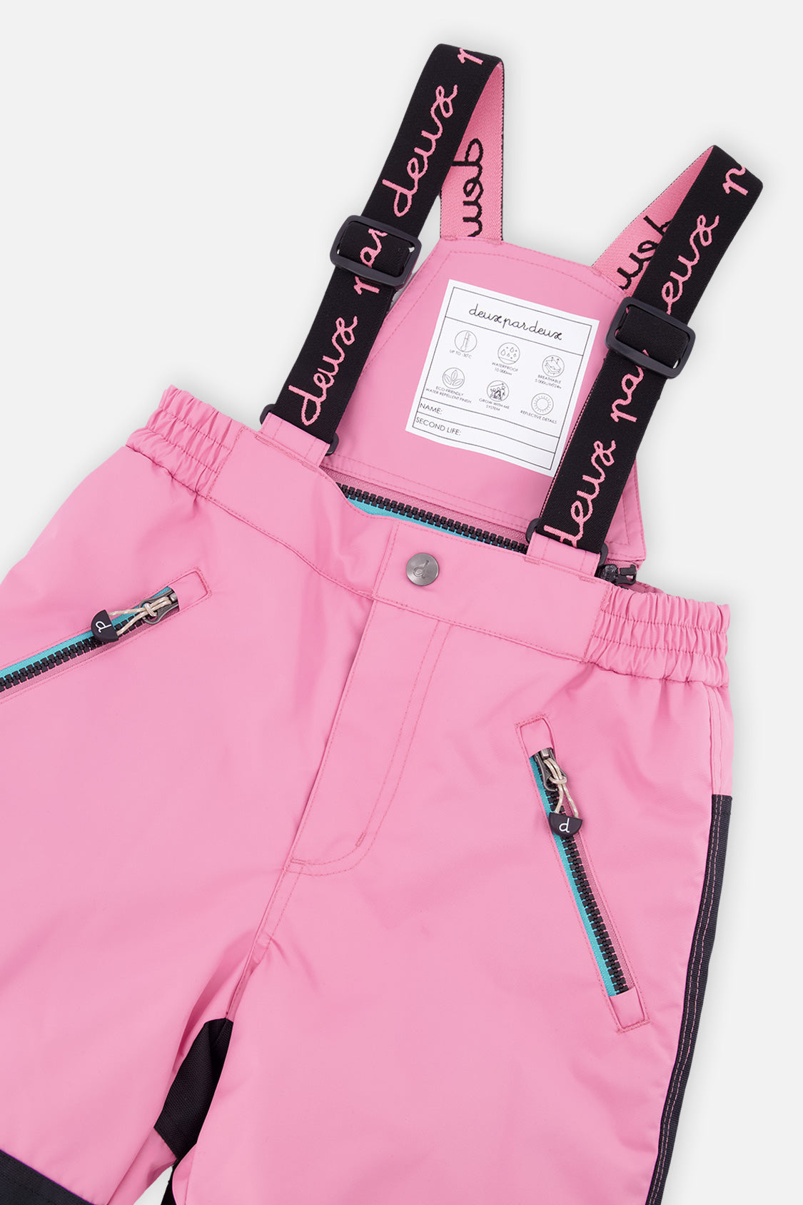 Close-up of the pink PLAY snow pants waist, zip pockets and logo suspenders