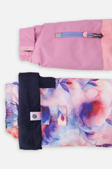 Close-up of the colorblock PLAY jacket sleeve pocket and floral pant hem