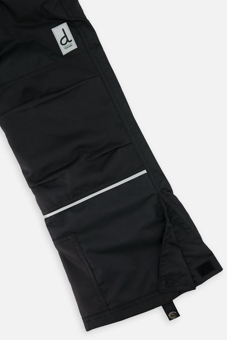 Deux par Deux boys' Teknik two-piece snowsuit in black and royal blue – snow pant leg and hem detail