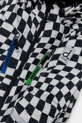 Close-up of the checkered print, chest zipper and logo on the TEKNIK jacket
