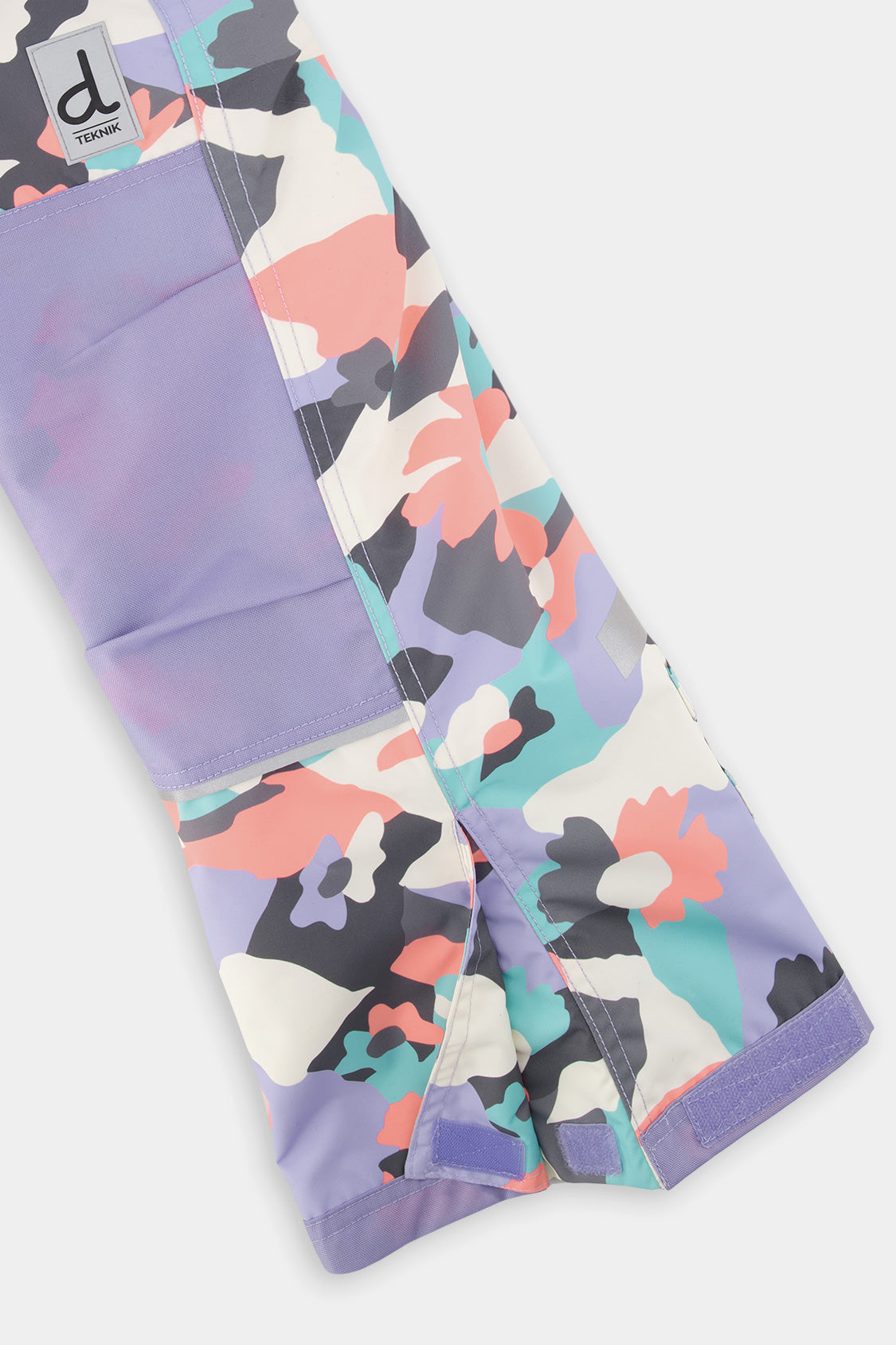 Deux par Deux girls' Teknik snowsuit, turquoise-orange-mauve color-block jacket, camo pants – snow pant leg and hem detail