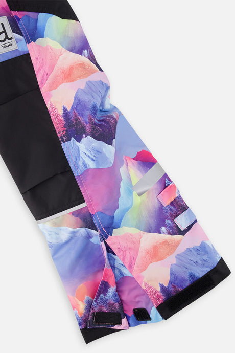 Deux par Deux girls' Teknik snowsuit, black jacket and pink-blue mountain print pants – snow pant leg and hem detail