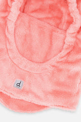 Close-up of the soft light pink fleece and white d logo label on the balaclava