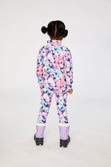Child wearing the purple floral thermal top and pants, back view