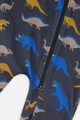 Close-up of the blue, mustard and beige dinosaurs and the front zipper on the charcoal one-piece