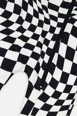 Close-up of the front zipper and wavy checkered print on the black and white Deux par Deux one piece thermal underwear