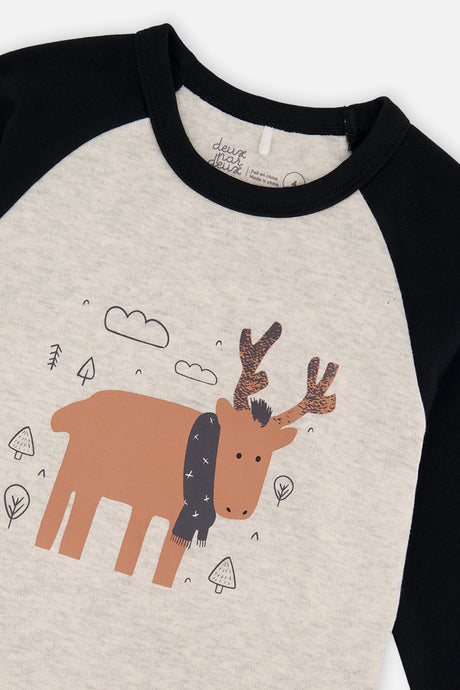 Close-up of the orange elk in a charcoal scarf and the black neckband on the oatmeal pajama top