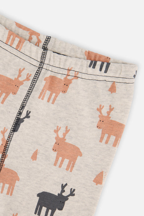 Close-up of the beige pants waist with orange and charcoal elk and the stitched leg seam